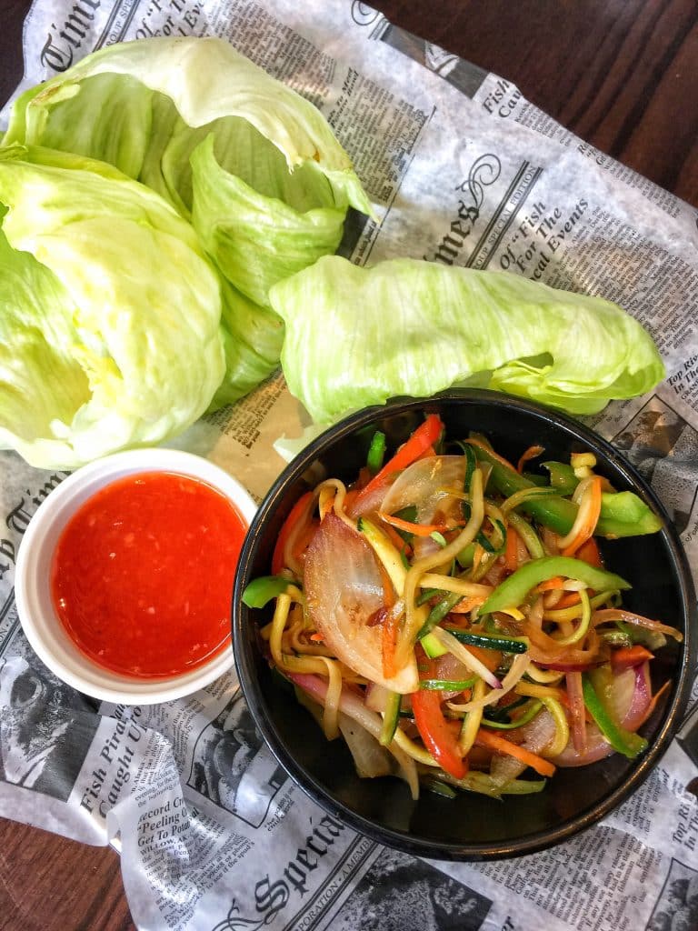 Veggie Lettuce Wraps Sautéed Peppers, Onions, Carrots, Squash, and Zucchini in Asian Sesame Marinade served with Iceberg Lettuce and crispy Wontons