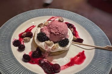 Plant-based Olive Oil Cake Olive Oil-Pistachio Cake, Blueberry Compote, Candied Pistachio, Blackberry Gelato Trattoria al Forno